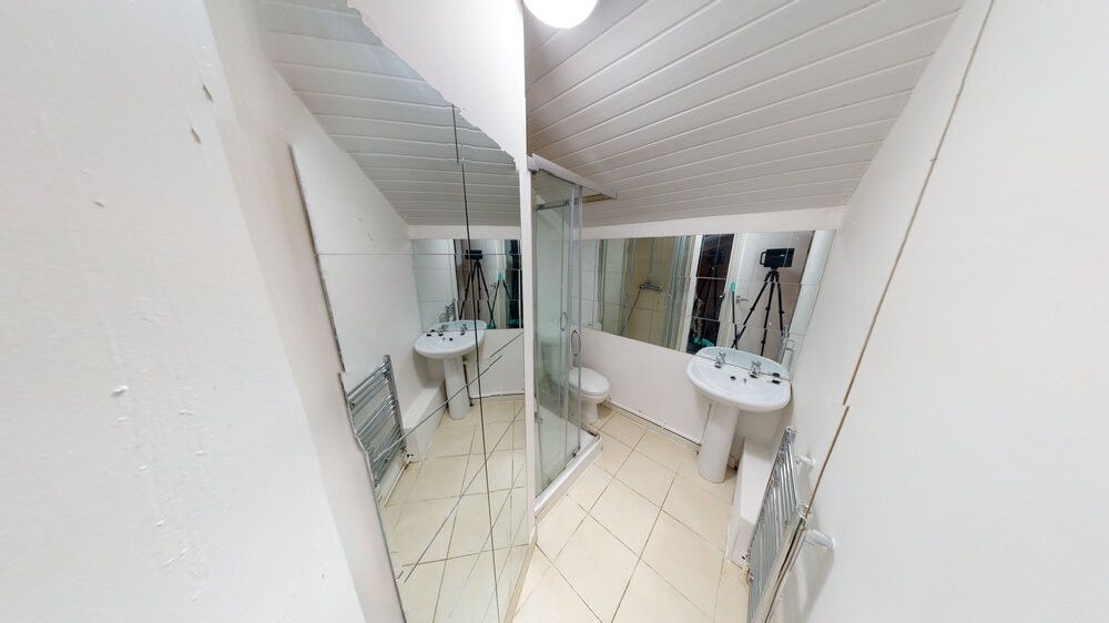 Property photo 3 of 4 Bright And Clean Bathroom Featuring A Modern Sink ...