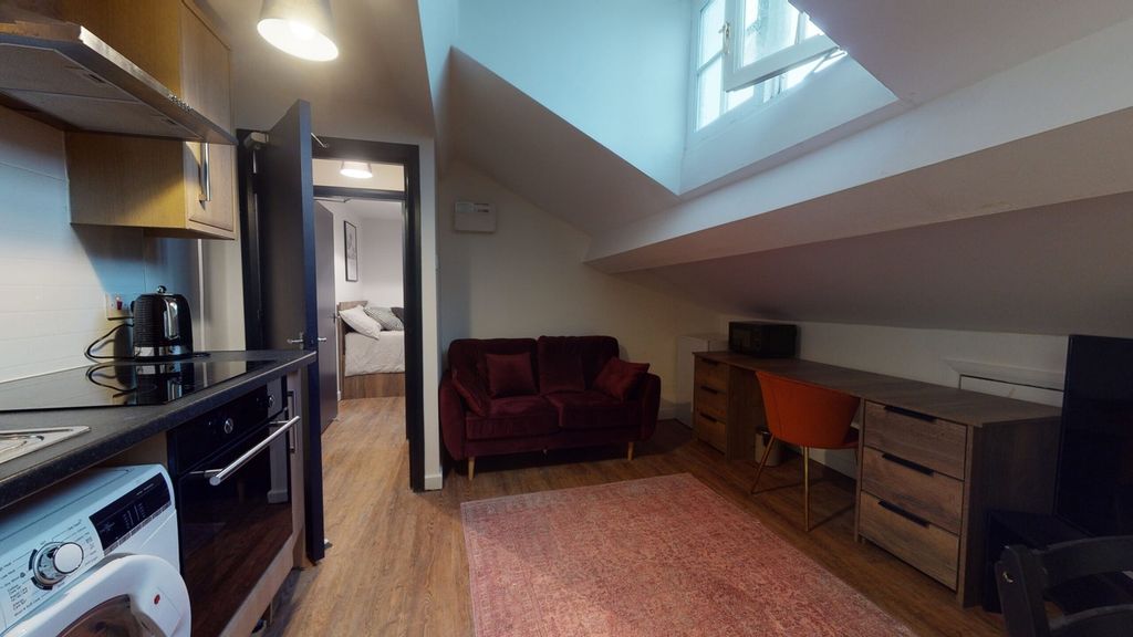 Property photo 3 of 5 A Bright And Inviting Living Room With Modern Deco...