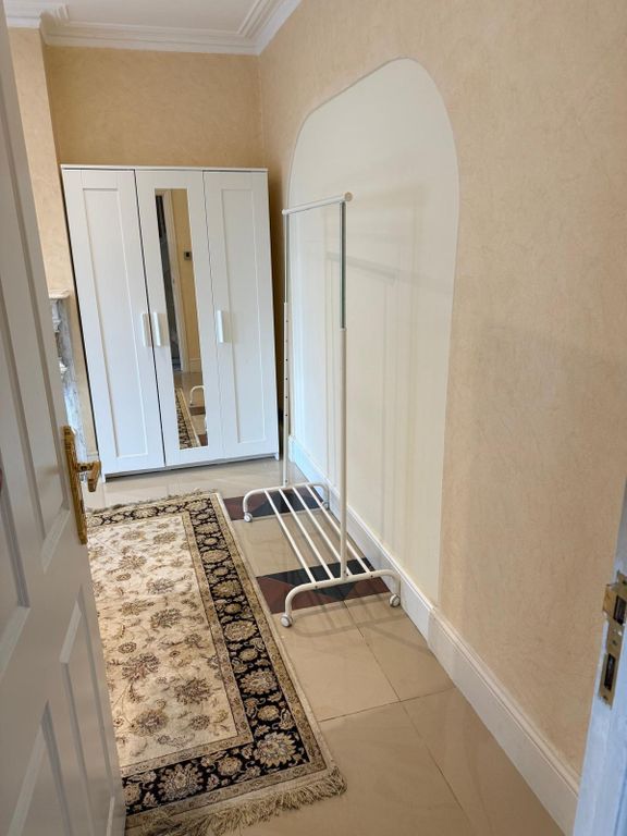 Property photo 3 of 3 Bright Hallway With Ample Storage And Large Rug...