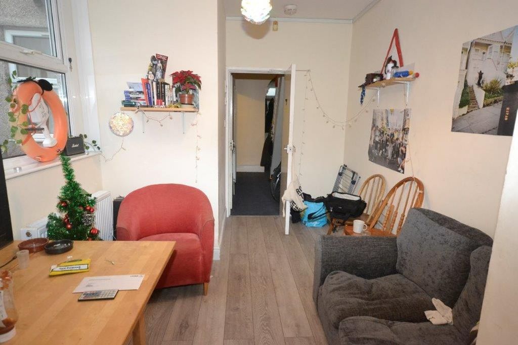 Property photo 3 of 12 A Cozy Living Room With Wooden Flooring And Minima...