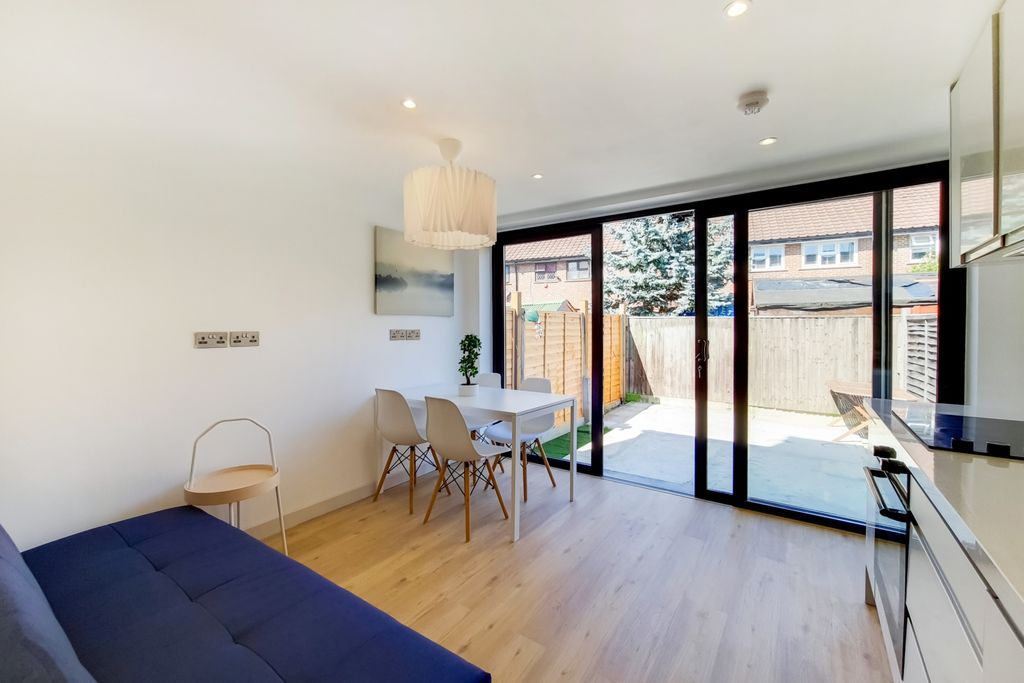 Property photo 3 of 7 Bright And Spacious Living Room Featuring Large Sl...