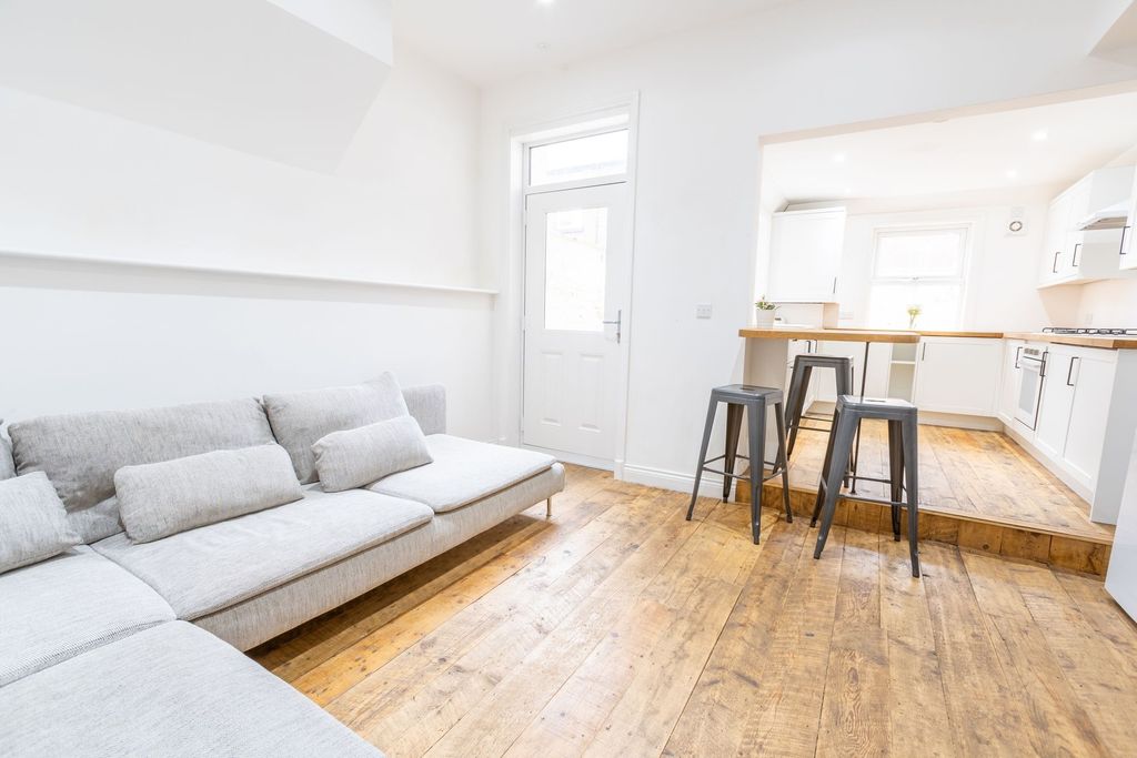 Property photo 2 of 7 Bright And Airy Living Space Featuring A Comfortab...