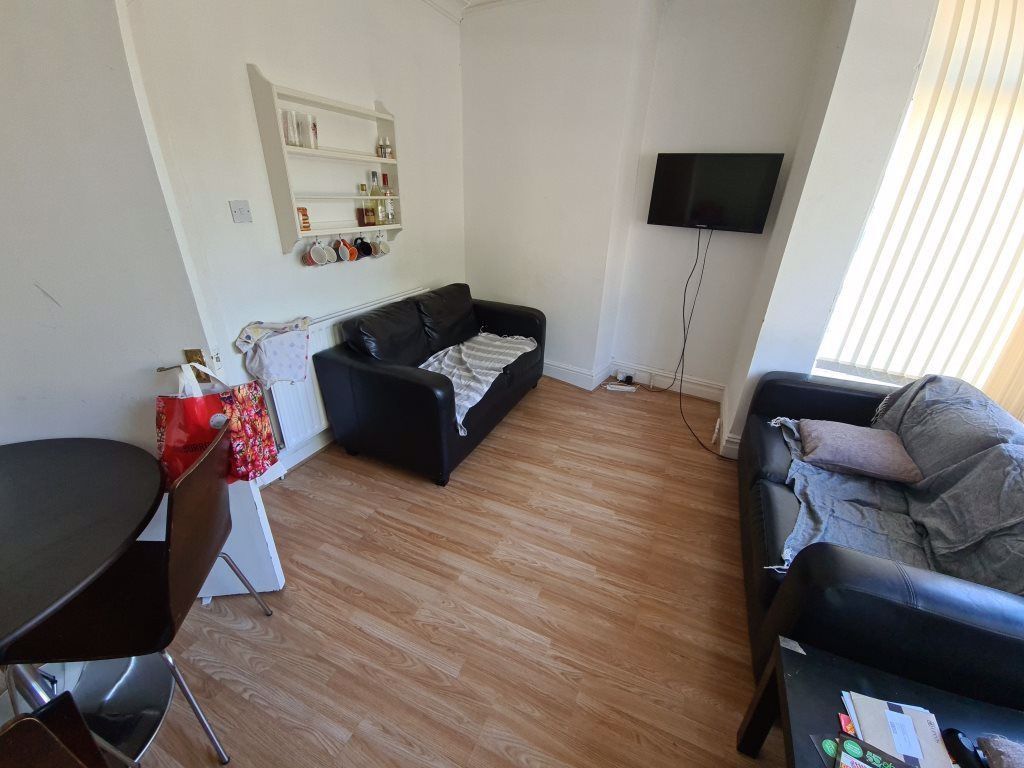 Property photo 1 of 18 A Well-Lit, Modern Living Room With Two Comfortabl...