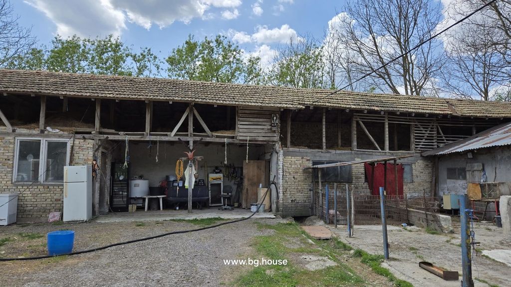 Property photo 1 of 54 Exterior View Of A Farmyard Showing Brick And Wooden Farm Buildings With Tiled Roofs And Open Storage Areas.