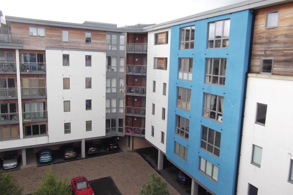 Property photo 1 of 7 Modern Apartment Complex With Vibrant Blue Facade...