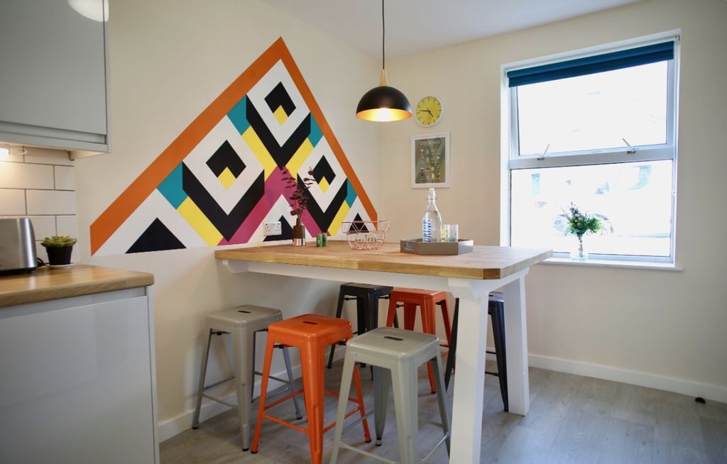 Property photo 1 of 4 A Vibrant Kitchen Featuring A Modern Design With c...