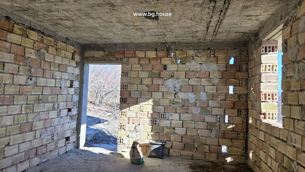 Property photo 3 of 36 Inside View Of An Unfinished Brick Room With An Open Doorway Leading Outside.