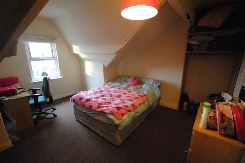 Property photo 1 of 9 A Cozy, Well-Lit Bedroom Featuring A Large Double ...