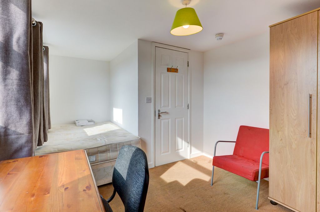 Property photo 1 of 11 A Bright And Well-Maintained Bedroom Featuring A d...