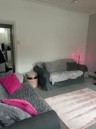 Property photo 2 of 22 Bright And Inviting Living Room Featuring Comforta...