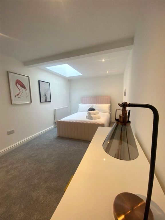 Property photo 1 of 10 A Bright And Modern Master Bedroom Featuring A Com...