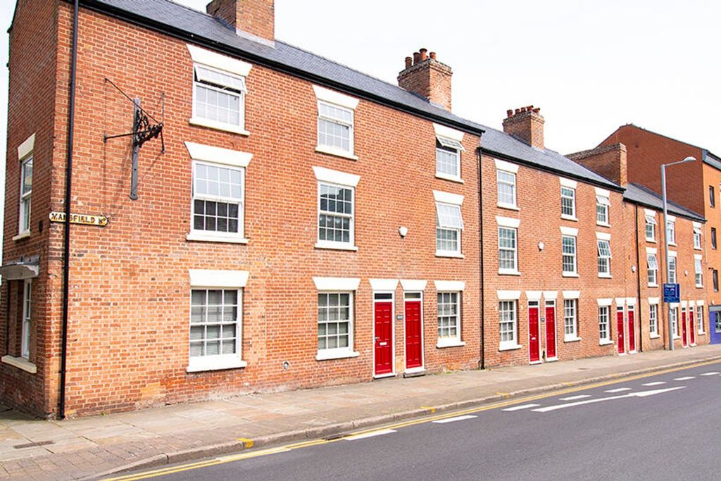 Property photo 2 of 8 Charming Red-Bricked Exterior Featuring A Series O...