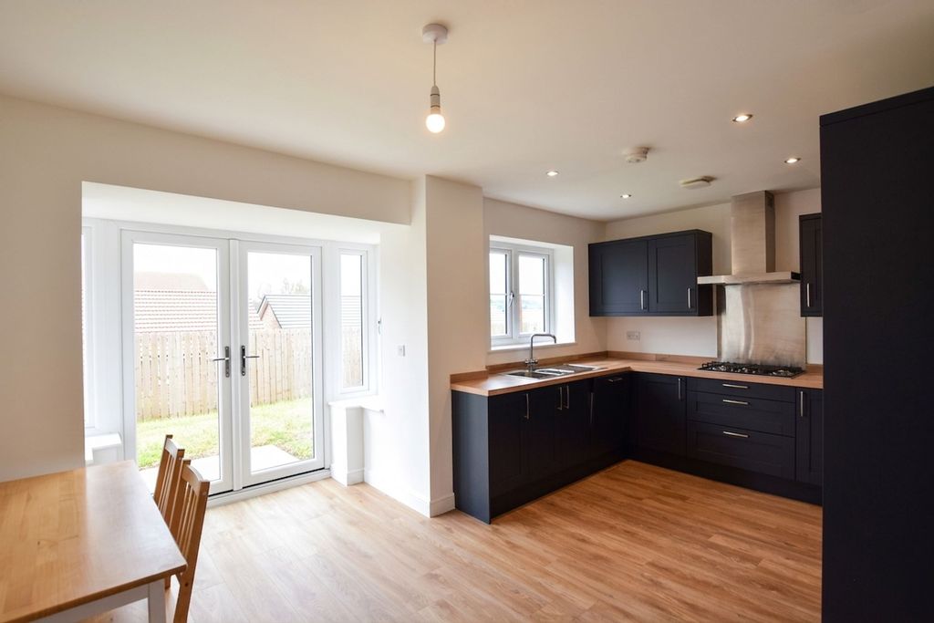 Property photo 3 of 13 Dining Kitchen