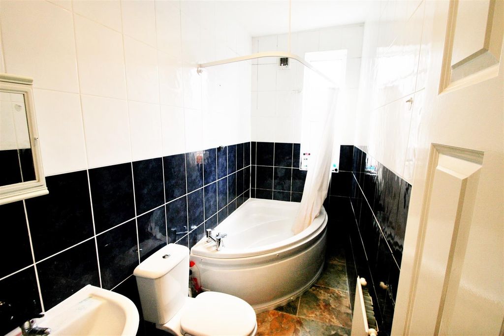 Property photo 3 of 5 Bright Bathroom With A Modern Corner Bathtub, A To...