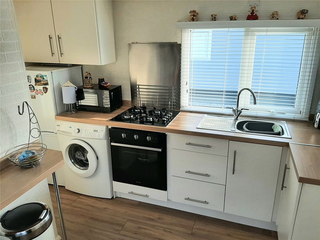 Property photo 2 of 12 Kitchen