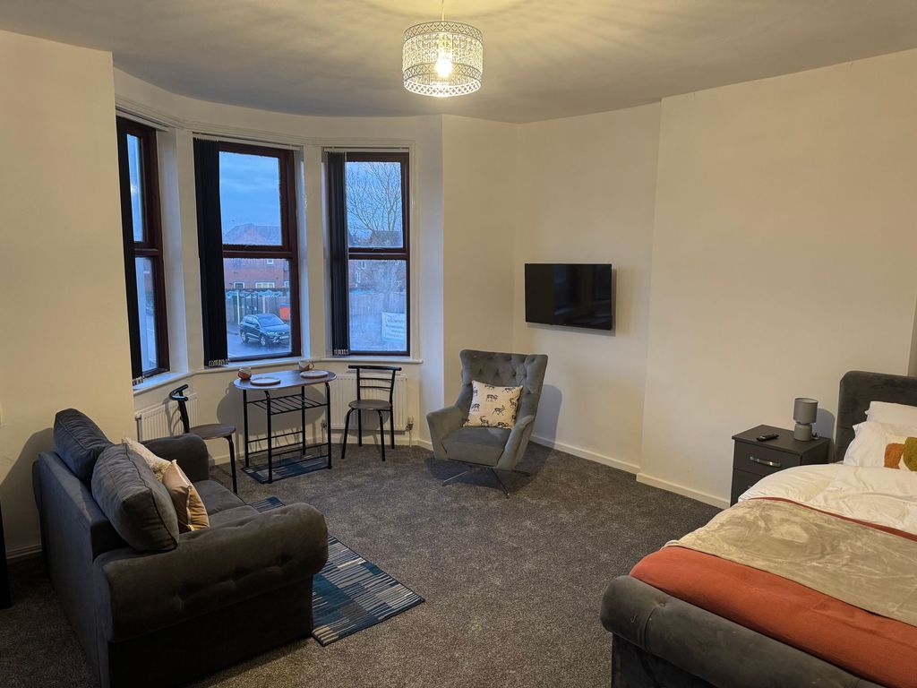Property photo 1 of 11 A Spacious And Inviting Master Bedroom Featuring A...