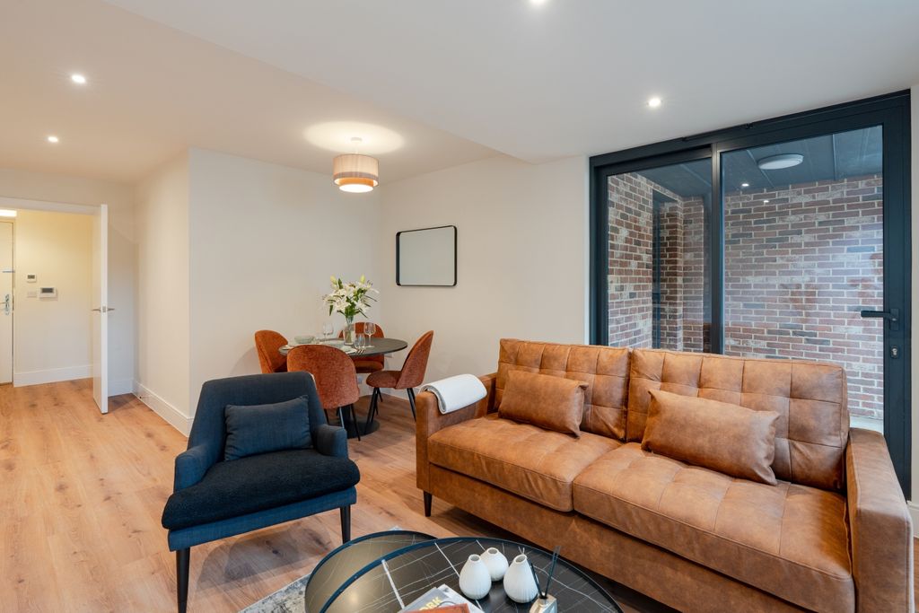 Property photo 2 of 12 Kitchen Living Area