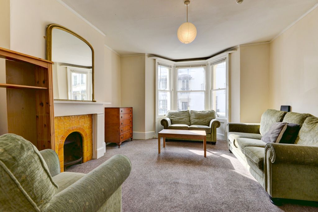 Property photo 3 of 15 Bright And Inviting Living Room With Large Windows...