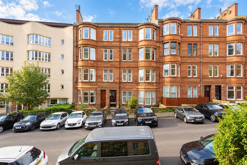 Property photo 1 of 29 Sunlit Sandstone Tenements And Parked Cars.Png