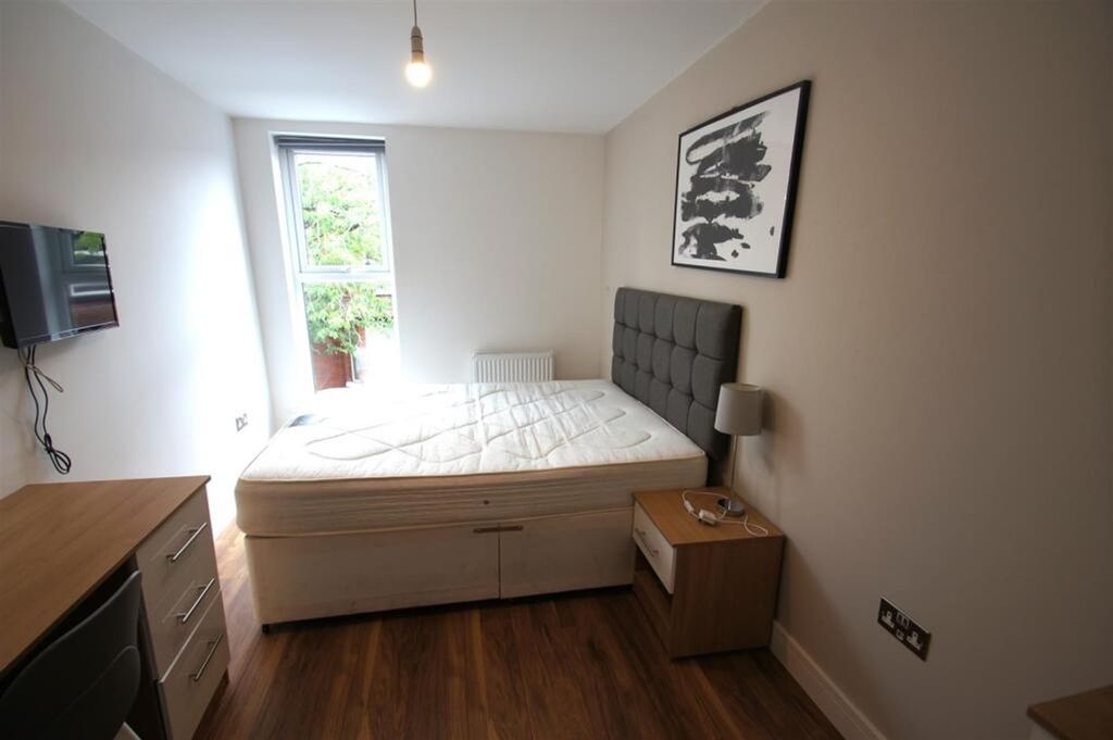 Property photo 3 of 12 This Inviting Double Bedroom Features Ample Natura...
