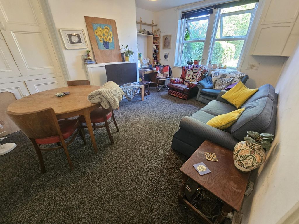 Property photo 1 of 7 A Spacious And Inviting Living Room Filled With Na...