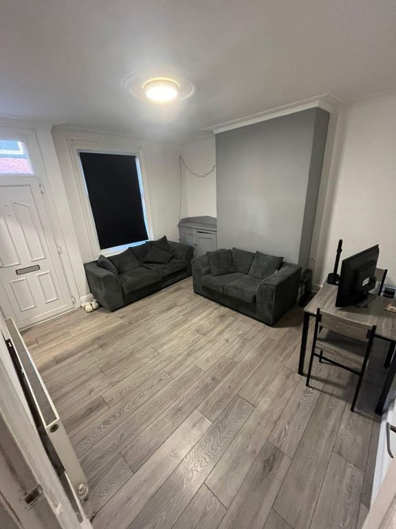 Property photo 3 of 31 A Contemporary And Spacious Living Room Featuring ...