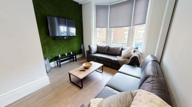 Property photo 2 of 8 A Modern Living Room Featuring Two Large, Comforta...