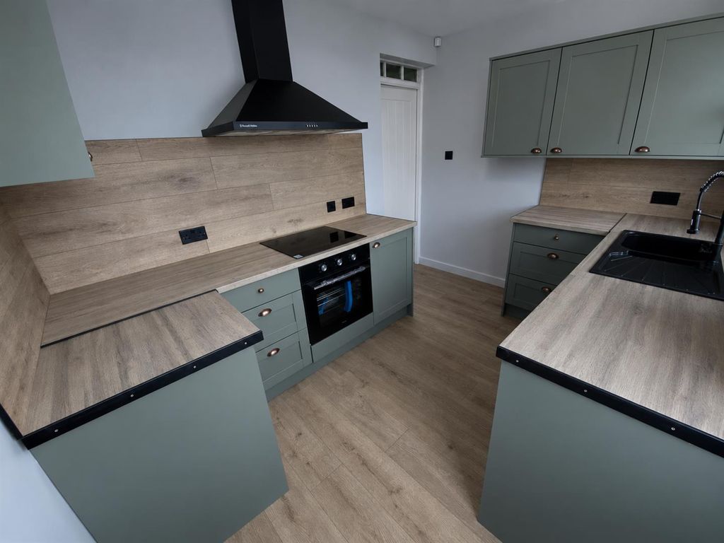 Property photo 2 of 11 Muted Sage Kitchen In Natural Daylight.Png
