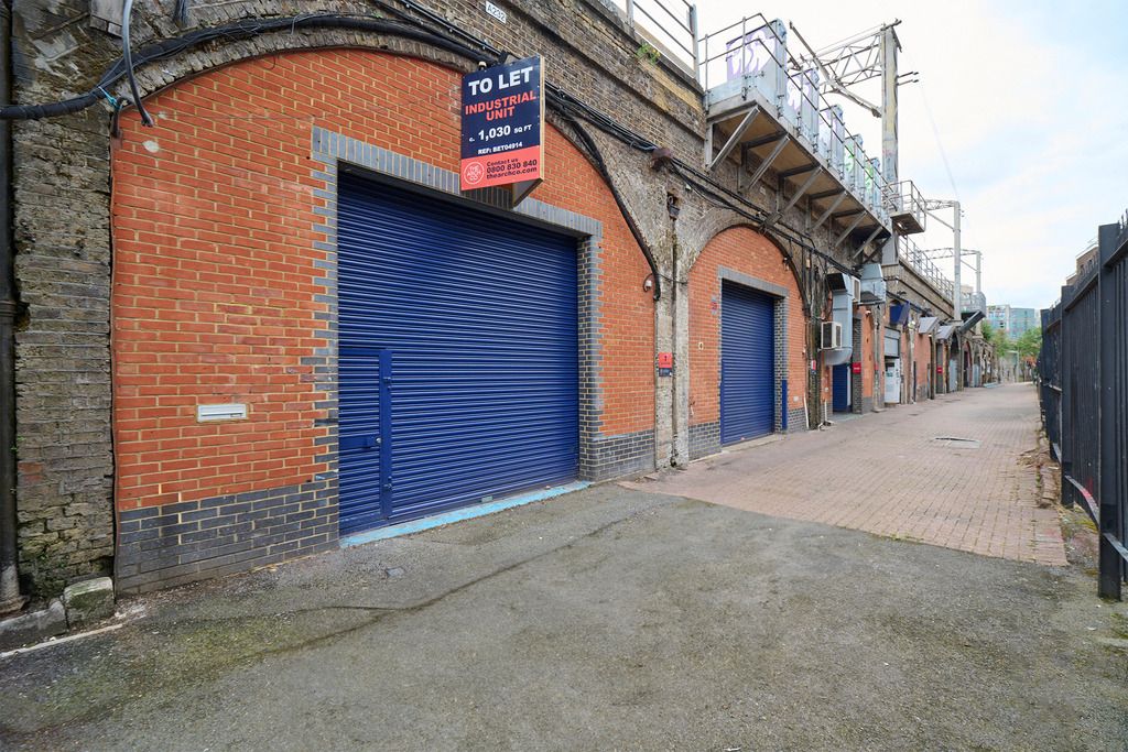 Property photo 2 of 5 An Estate, With Multiple Arches Next To Each Other. The Arches Have Closed Electric Roller Shutter Entrances.