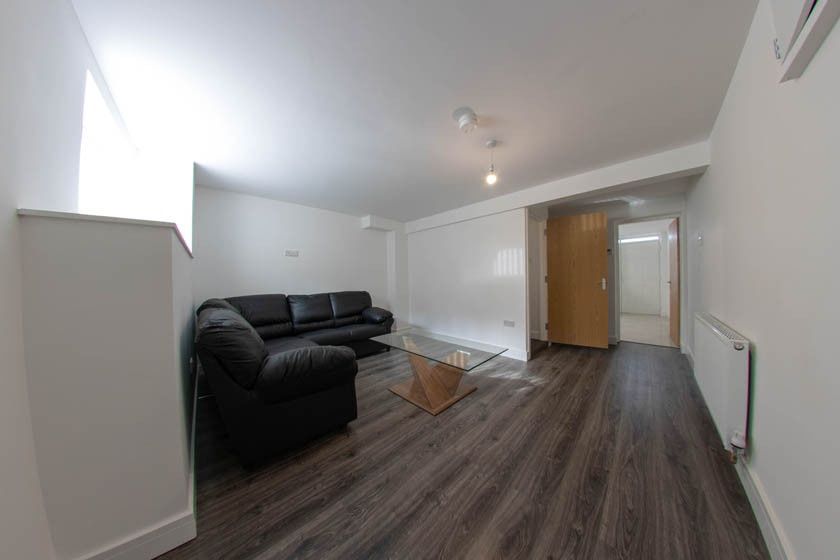 Property photo 2 of 18 Contemporary Furnished Living Area With Dark Lamin...