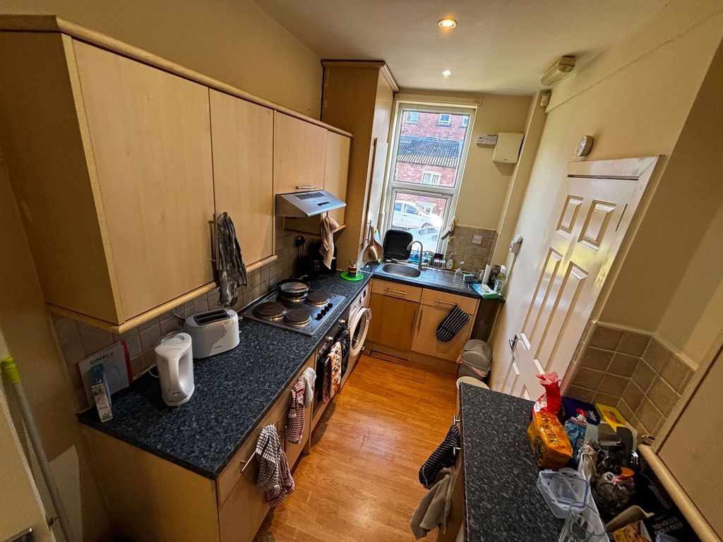 Property photo 3 of 10 Bright Galley Kitchen With Wood-Effect Cabinets, d...