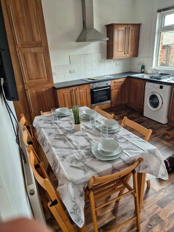 Property photo 3 of 9 Spacious Kitchen With Modern Cabinetry And Ample d...