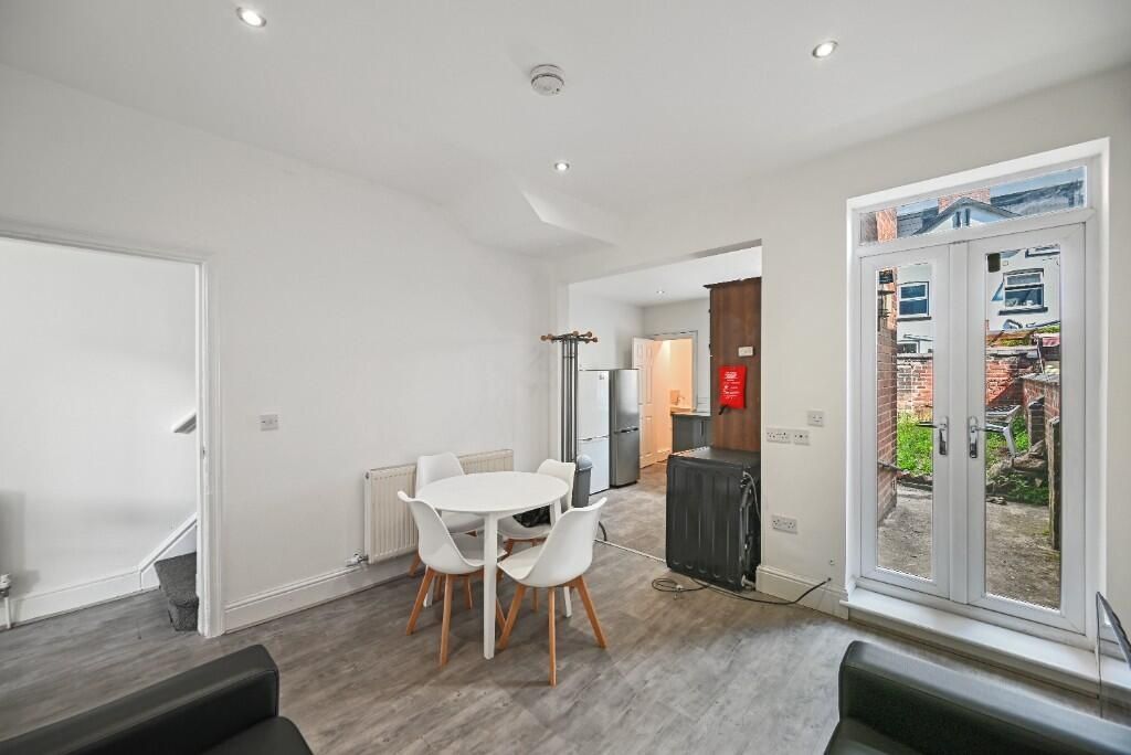 Property photo 2 of 10 Bright And Welcoming Living Room Featuring Modern ...