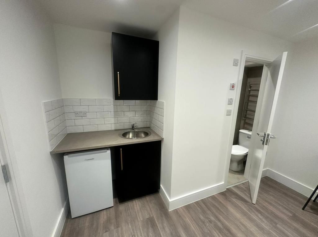 Property photo 2 of 6 Kitchen Area