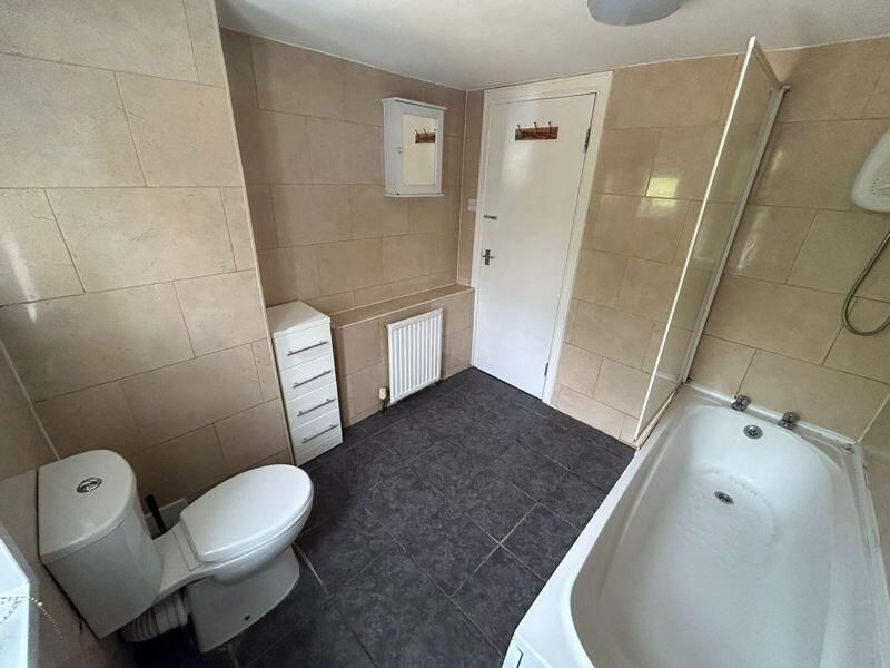 Property photo 2 of 9 A Clean And Bright Bathroom Featuring A Toilet, Ba...