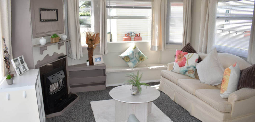 Property photo 2 of 11 Bright Lounge Area With Cream Sofa, Feature Fireplace And Large Front Windows
