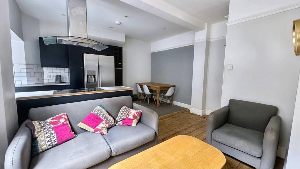 Property photo 1 of 15 Bright And Modern Living Area Featuring A Comforta...