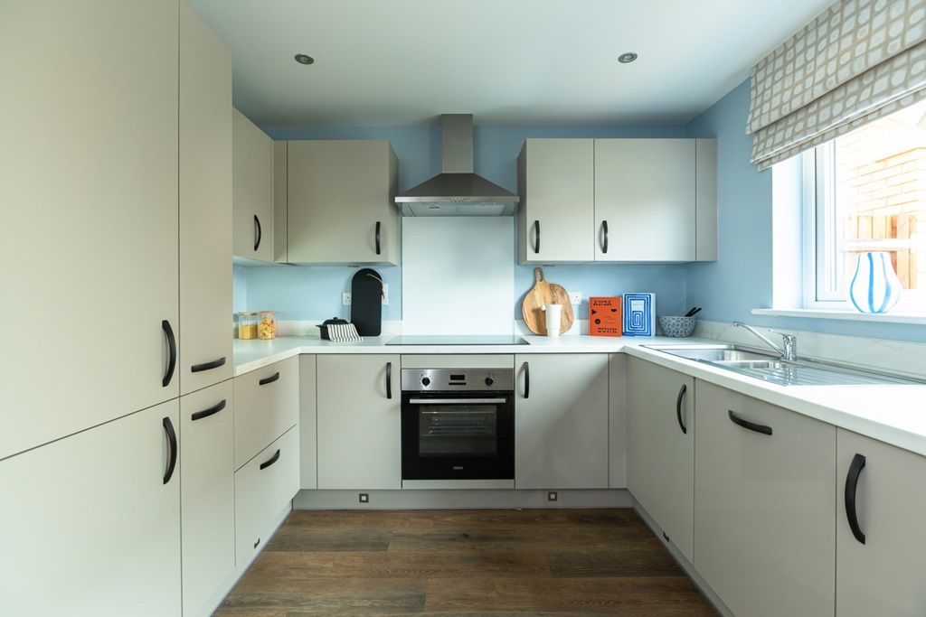 Property photo 3 of 13 The Modern Kitchen Offers Ample Storage Space
