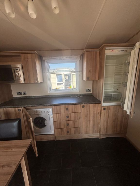 Property photo 3 of 12 Kitchen With Integrated Washing Machine, Fridge Freezer And Microwave