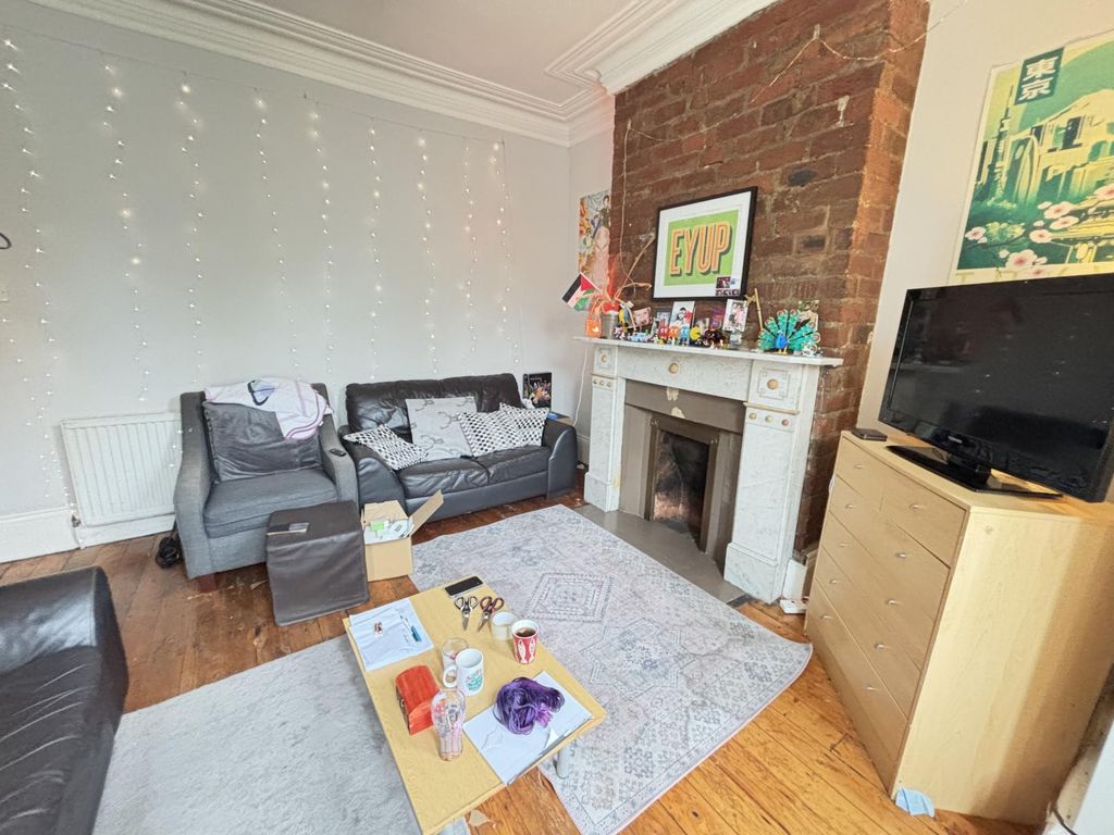 Property photo 3 of 22 A Well-Lit, Comfortable Living Room With Modern Fu...