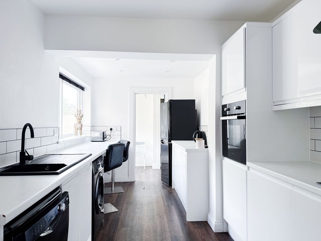 Property photo 1 of 11 Bright, Modern Galley Kitchen With White Cabinetry...