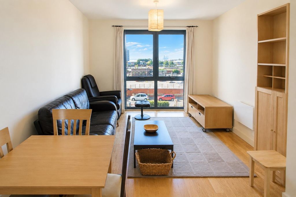 Property photo 1 of 7 Bright Living Room With Large Window And Sofa...