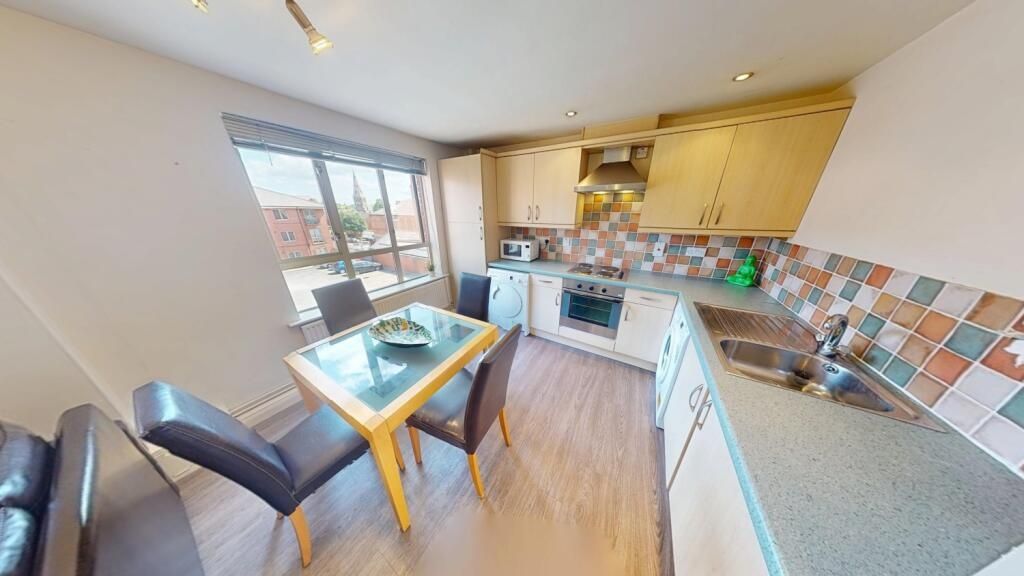 Property photo 2 of 8 Bright And Modern Kitchen Featuring Tiled Backspla...