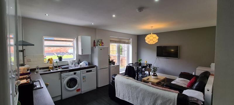 Property photo 1 of 8 A Spacious And Well-Lit Living Room Featuring Mode...