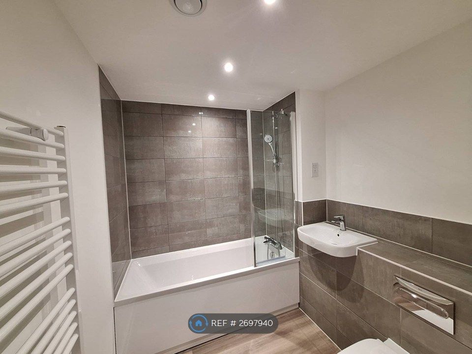 Property photo 3 of 6 Bathroom With Tub And Shower With Folded Screen