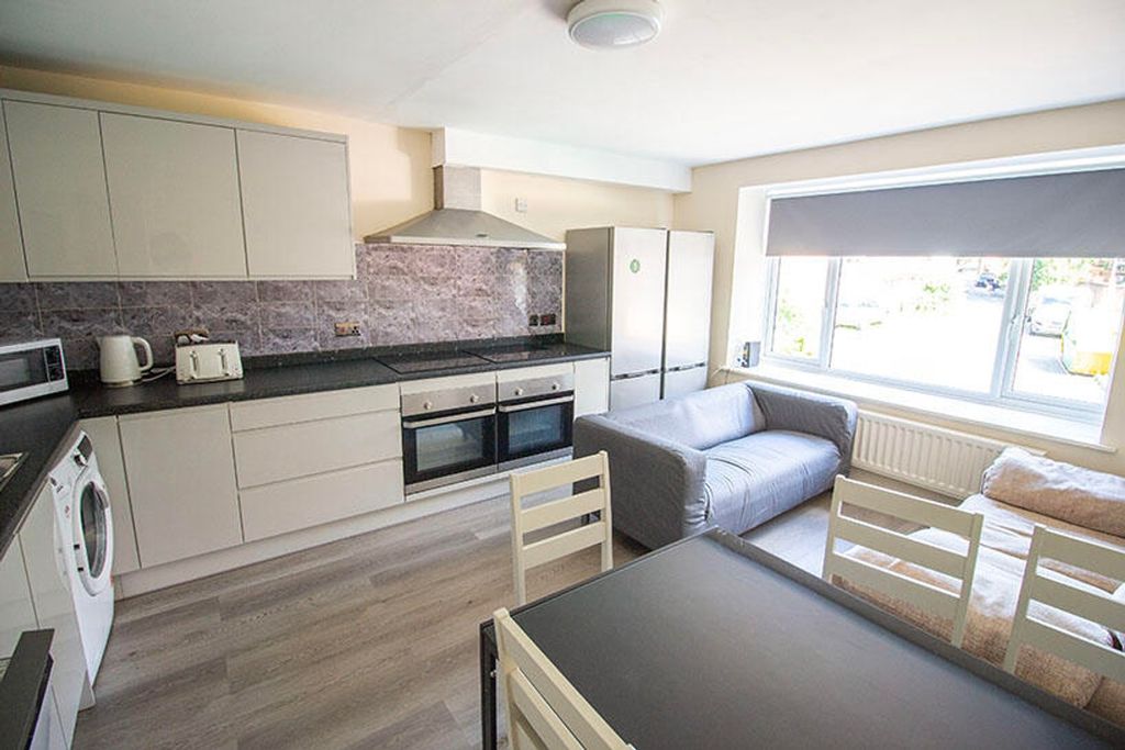 Property photo 1 of 4 This Stylish Kitchen Features Modern Appliances, A...