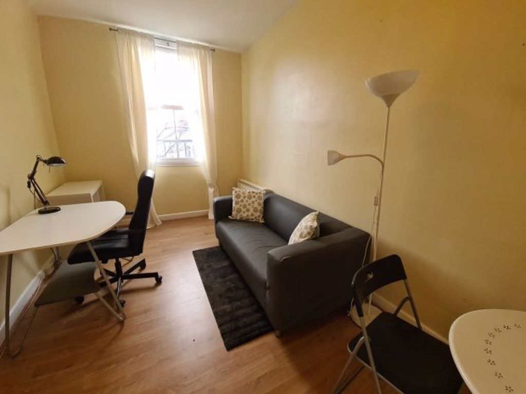 Property photo 1 of 5 A Cozy Single Bedroom Featuring A Compact Workspac...