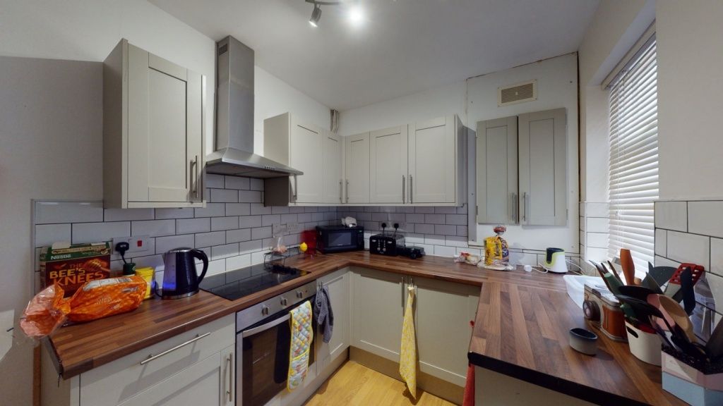 Property photo 2 of 7 Bright And Modern Kitchen Featuring Wooden Counter...