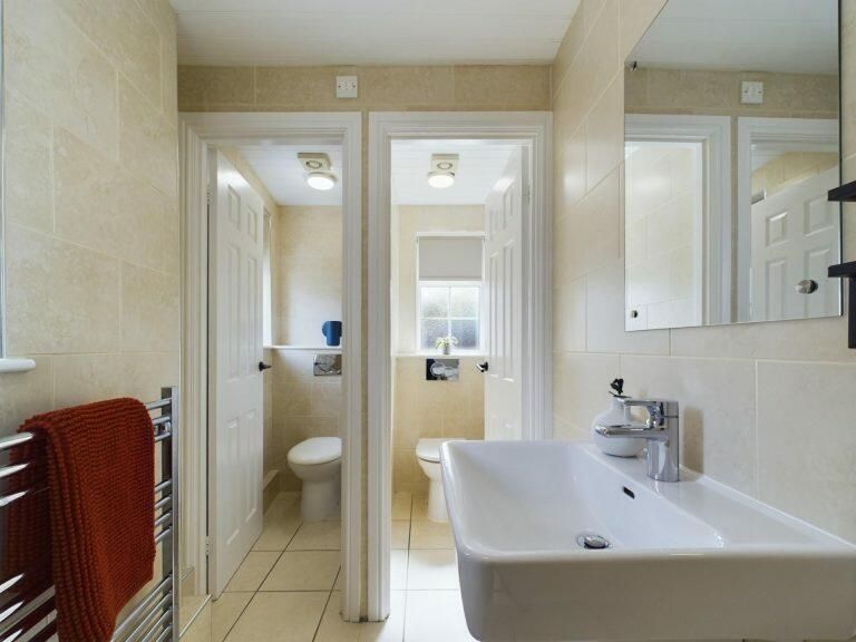Property photo 3 of 9 Bright And Modern Bathroom Suite Featuring A Clean...