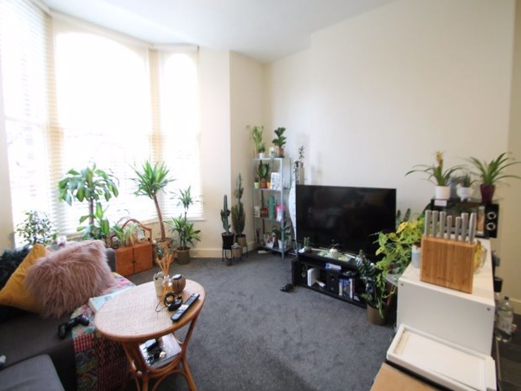 Property photo 3 of 14 Bright And Welcoming Living Room With Ample Natura...